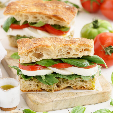 Caprese sandwich with tomato, fresh mozzarella and basil.
