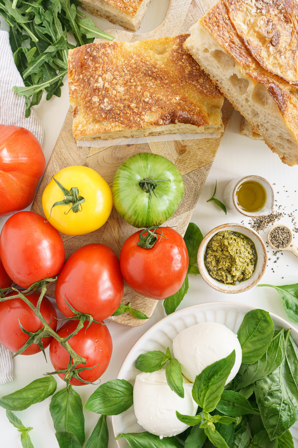 Ingredients to make a caprese sandwich on the table.