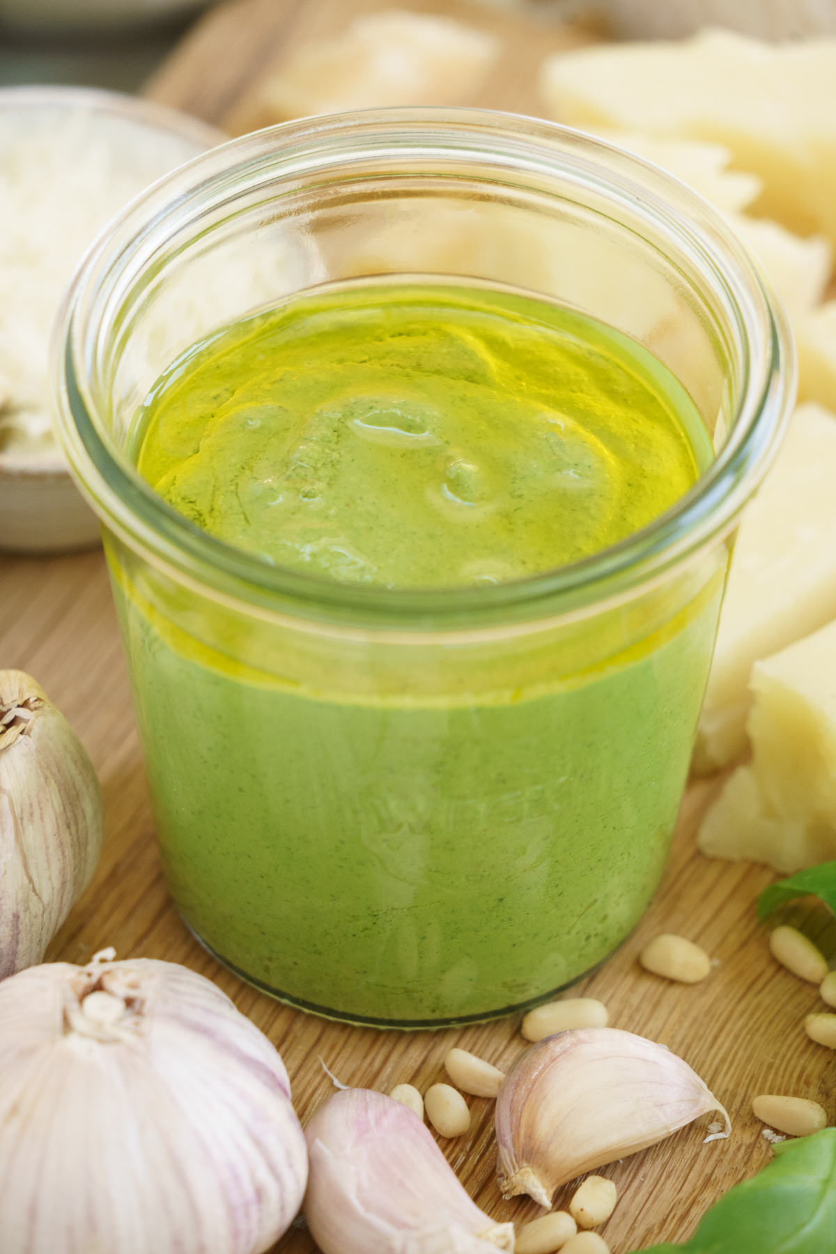 Closeup of basil pesto in a jar.