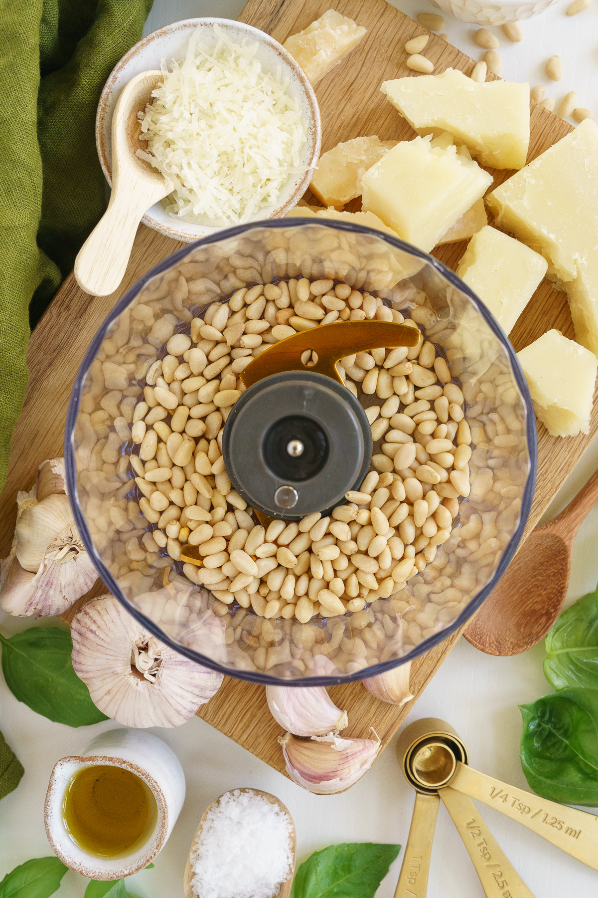 Pine nuts added to the food processor.