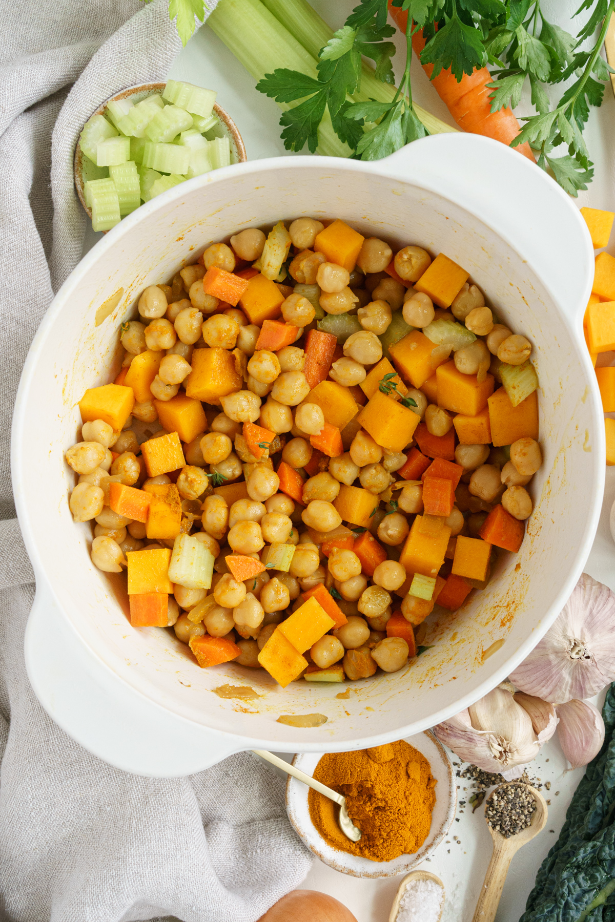 Chickpeas added to the pot to make turmeric soup recipe.