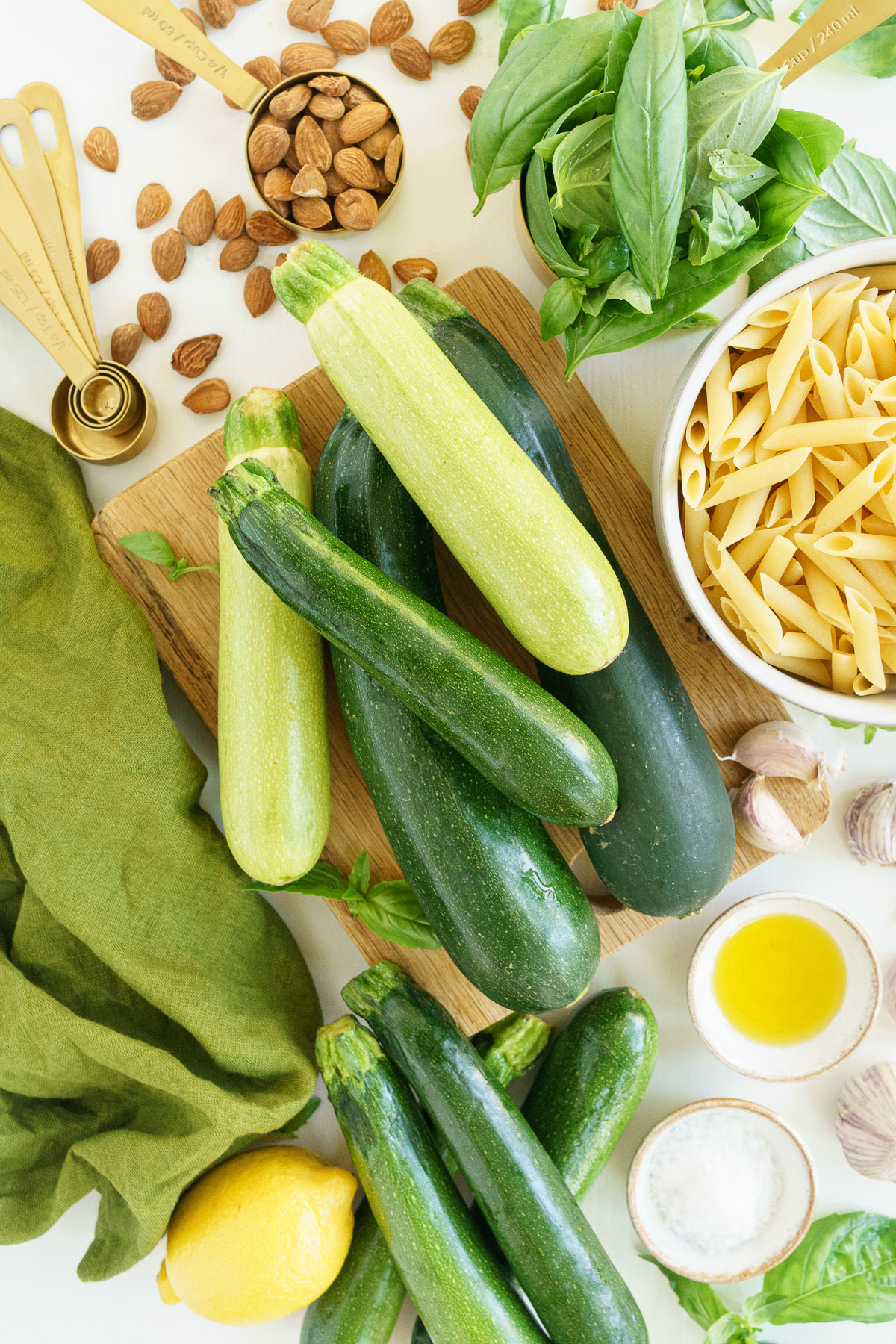 Ingredients to make zucchini pesto pasta bowl.