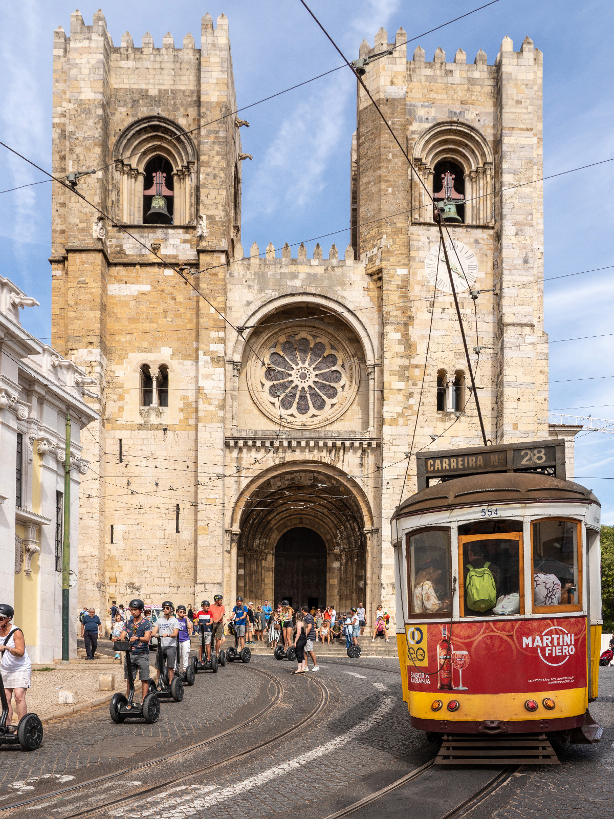 Tram passing in front of Tram 28 in front of Lisbon Cathedral (S&eacute; de Lisboa)