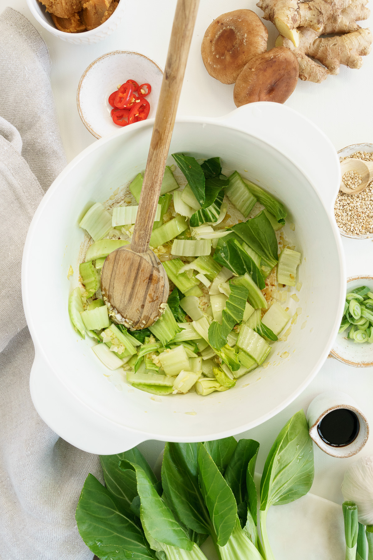 Top view of saut&eacute;ing vegetables in a white pot