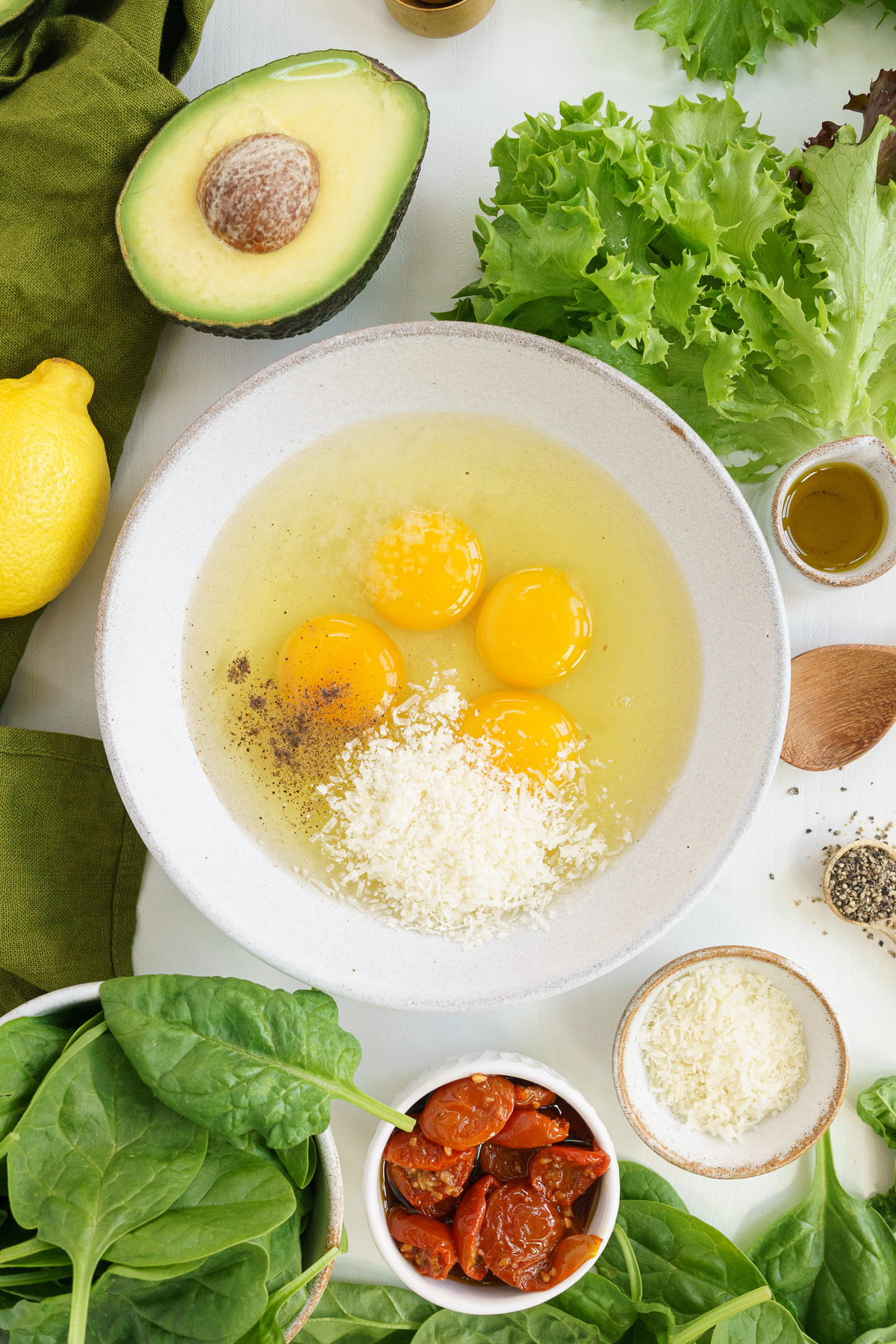 Top View of unbeaten eggs with seasoning on a bowl