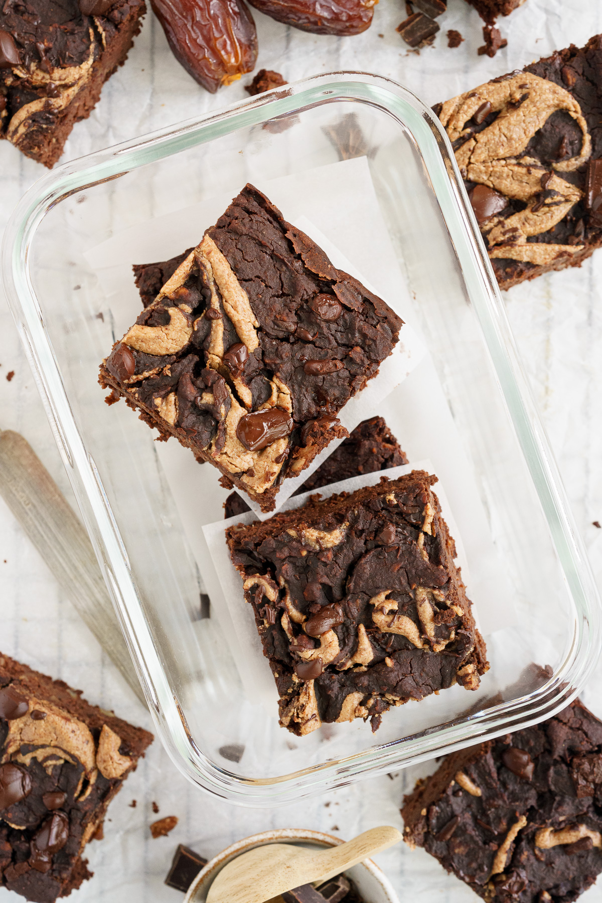 Top view of black bean brownies in a glass container for storage