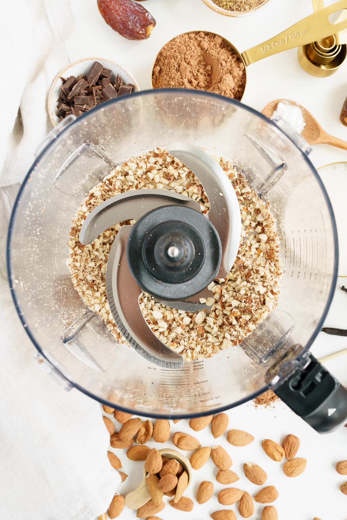 top view of almonds chopped in a food processor bowl