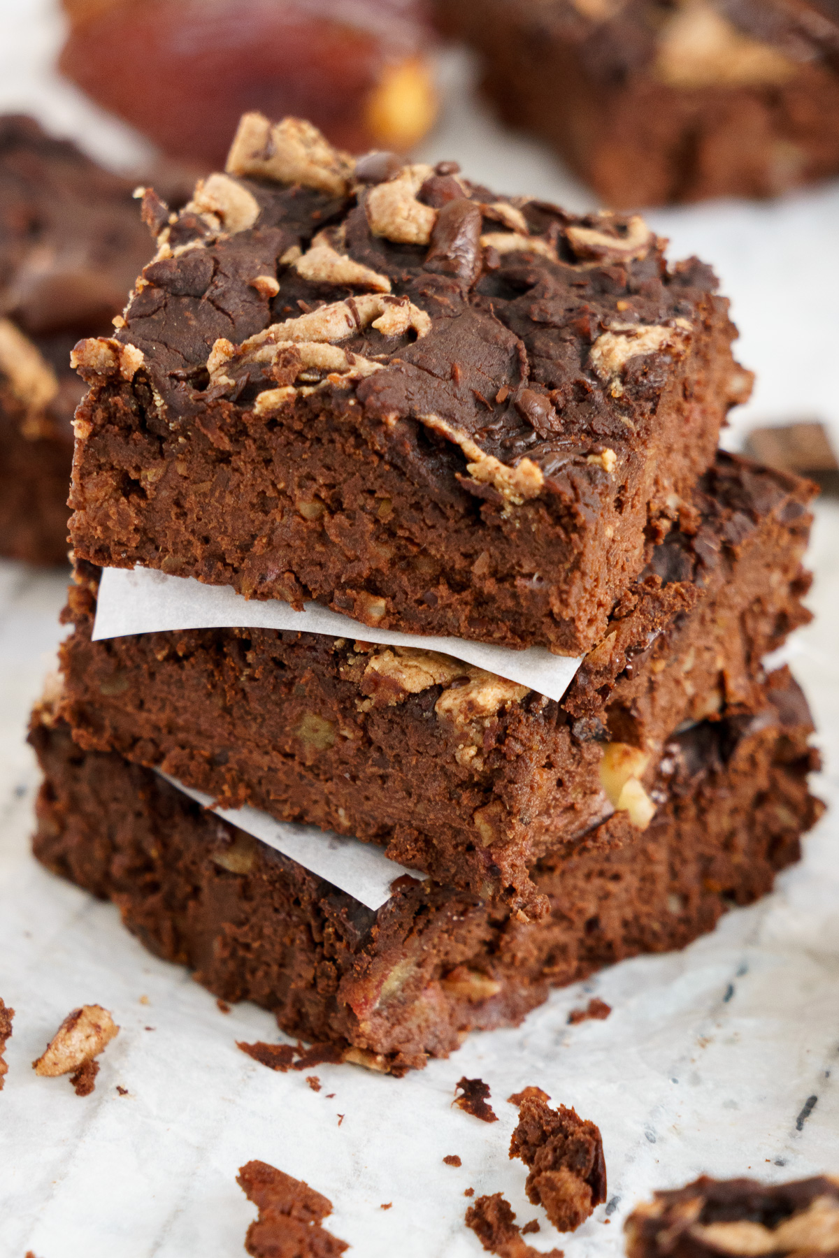 Close up of a stack of 3 pieces of black bean brownies