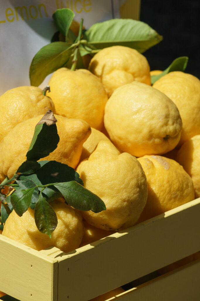 Fresh lemons in a wood case