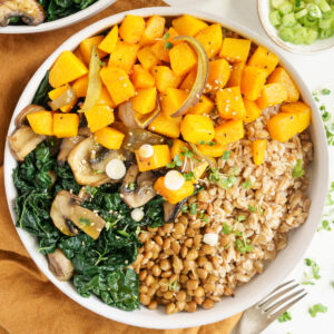 Butternut squash bowl with kale, grains and mushrooms.