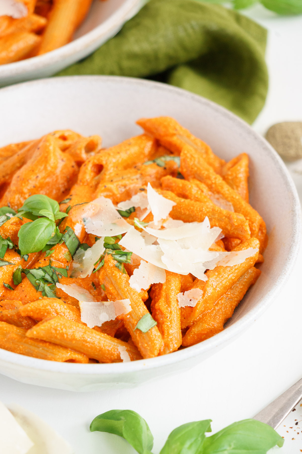 Three quarter view of plate filled with roasted red pepper pasta