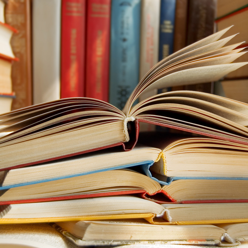 A pile of old open books