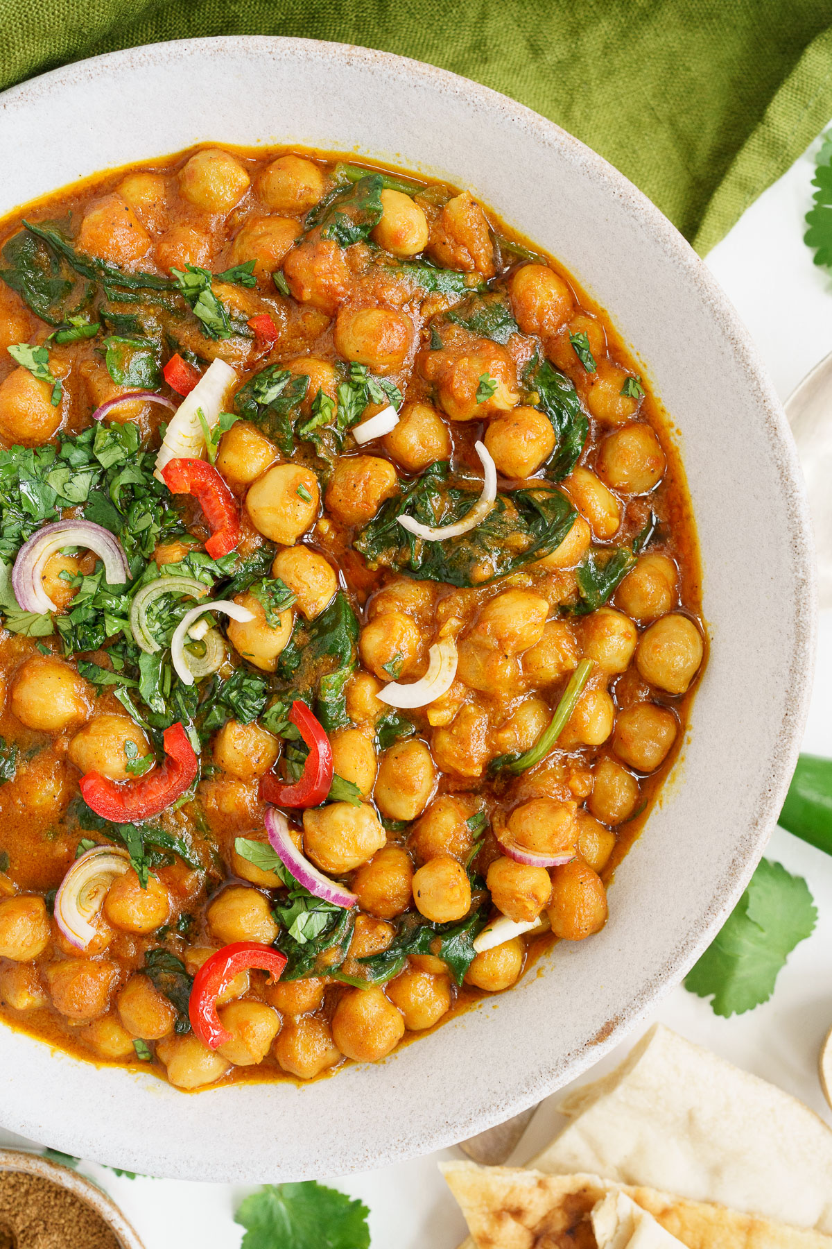 Top view of half a plate filled with vegan chickpea curry