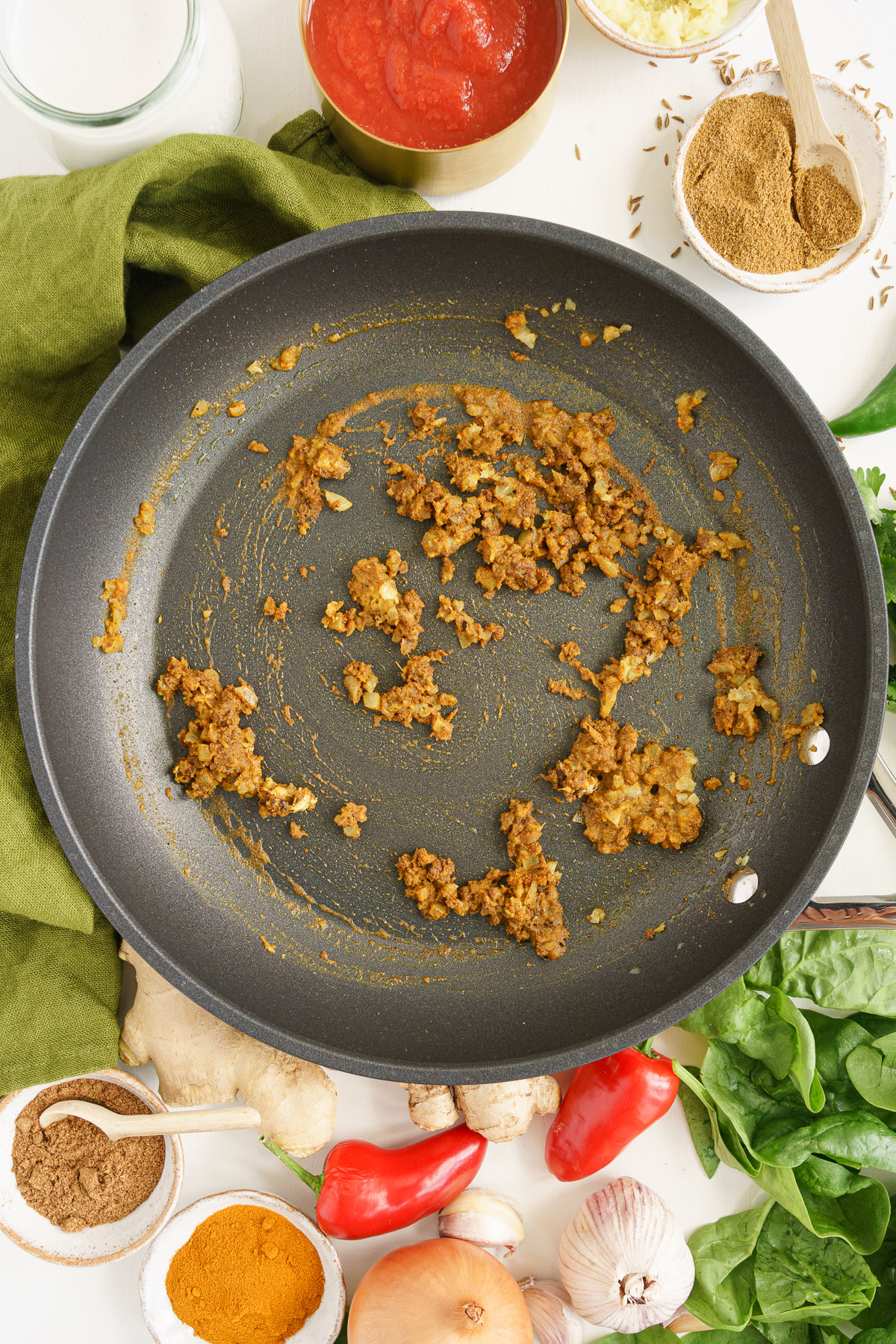 Cooking the aromatics in a skillet.