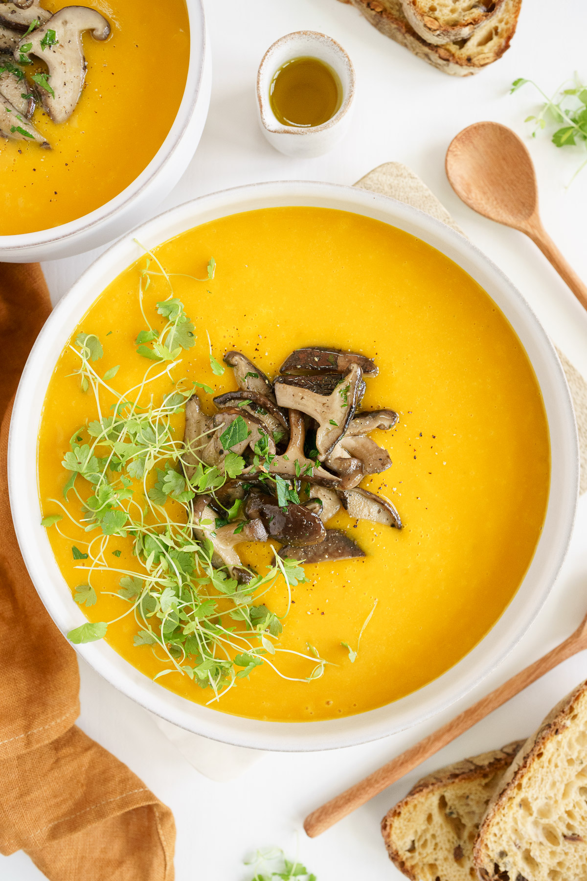 top view of the pumpkin soup in a bowl with mushroom toppings
