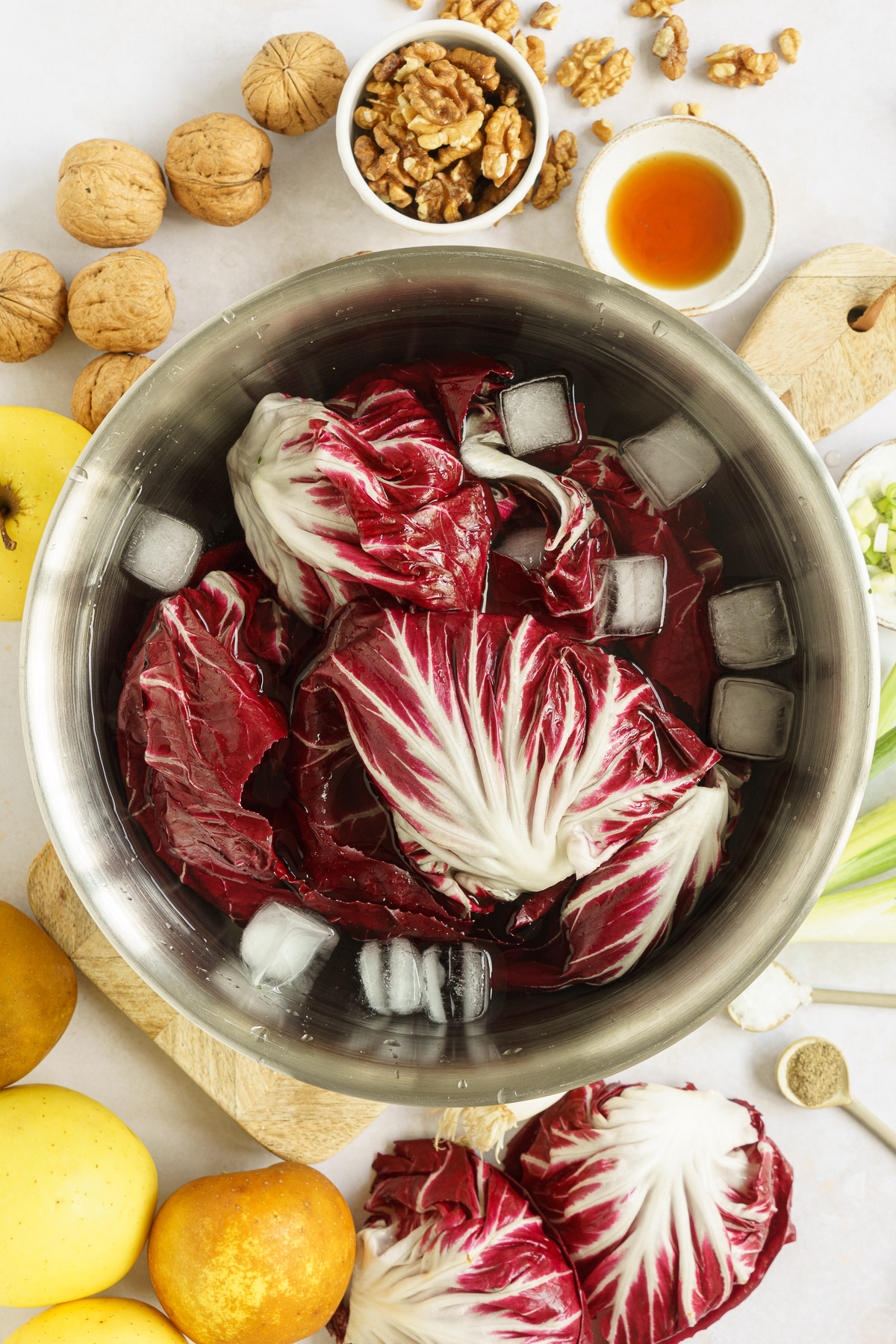 radicchio leaves soak in water with ice cubes