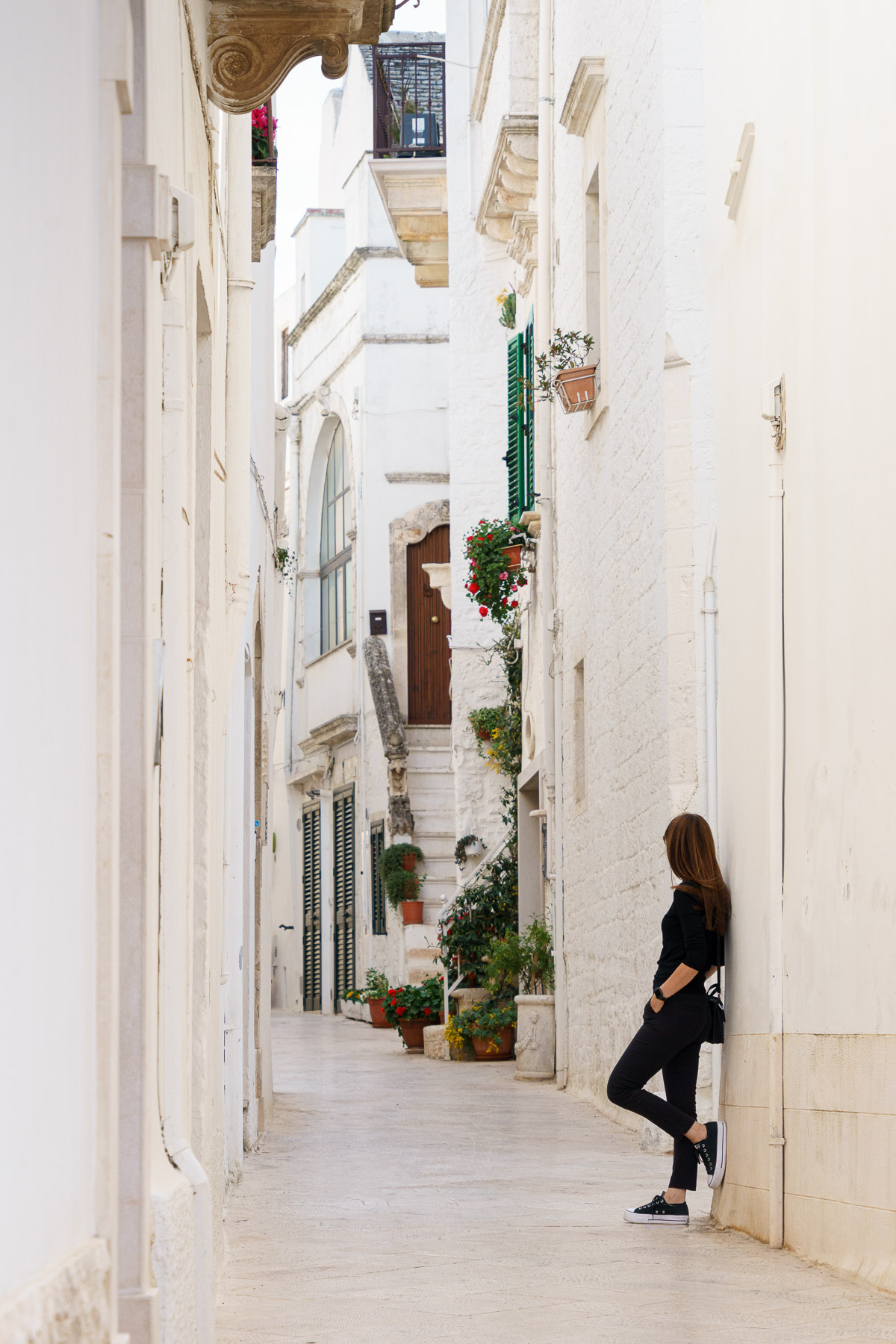 Woman admiring streets in Locorotondo