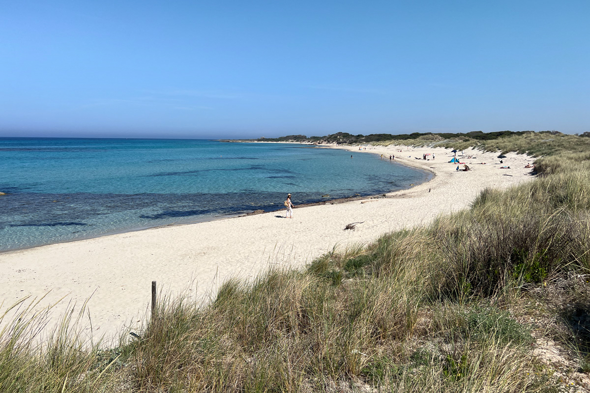 Woman taking a stroll in Torre Guaceto