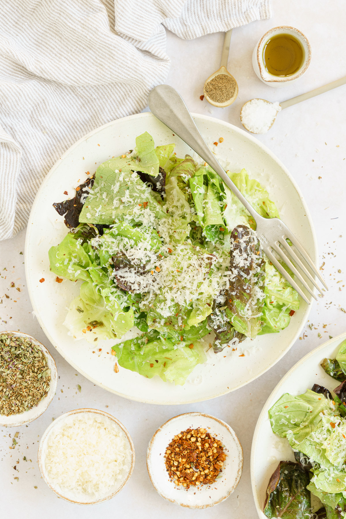 Plate filled with lettuce salad on a table