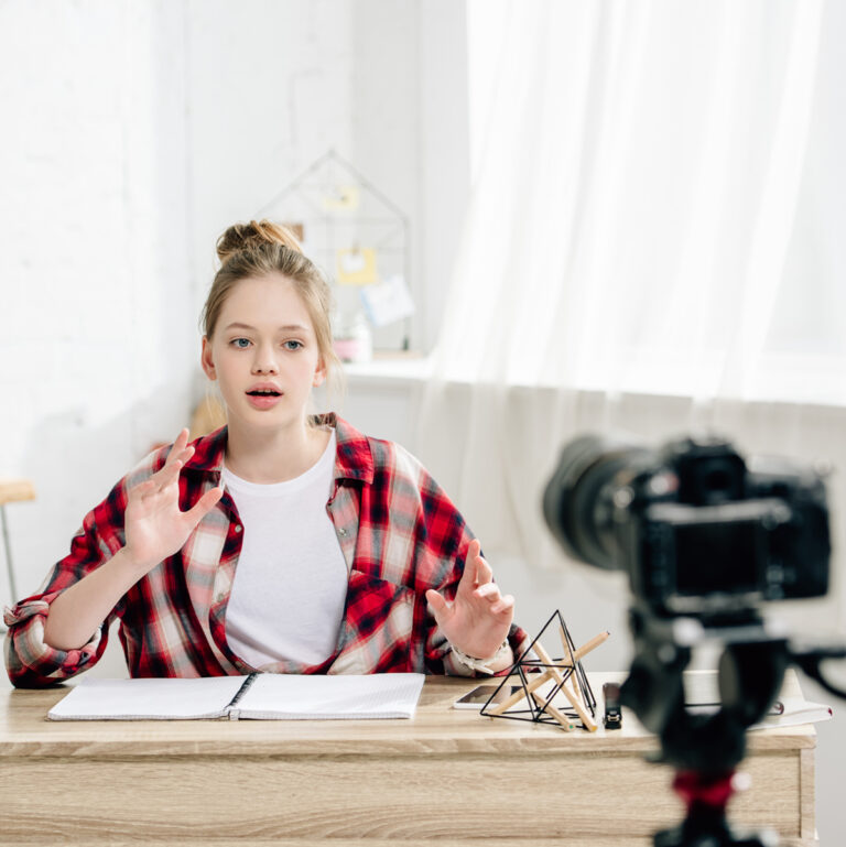 Teenage girl shooting a YouTube video