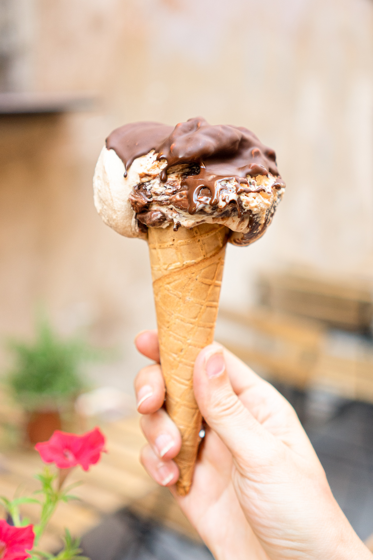 Hand holding one of the est gelato in Rome at Frigidarium