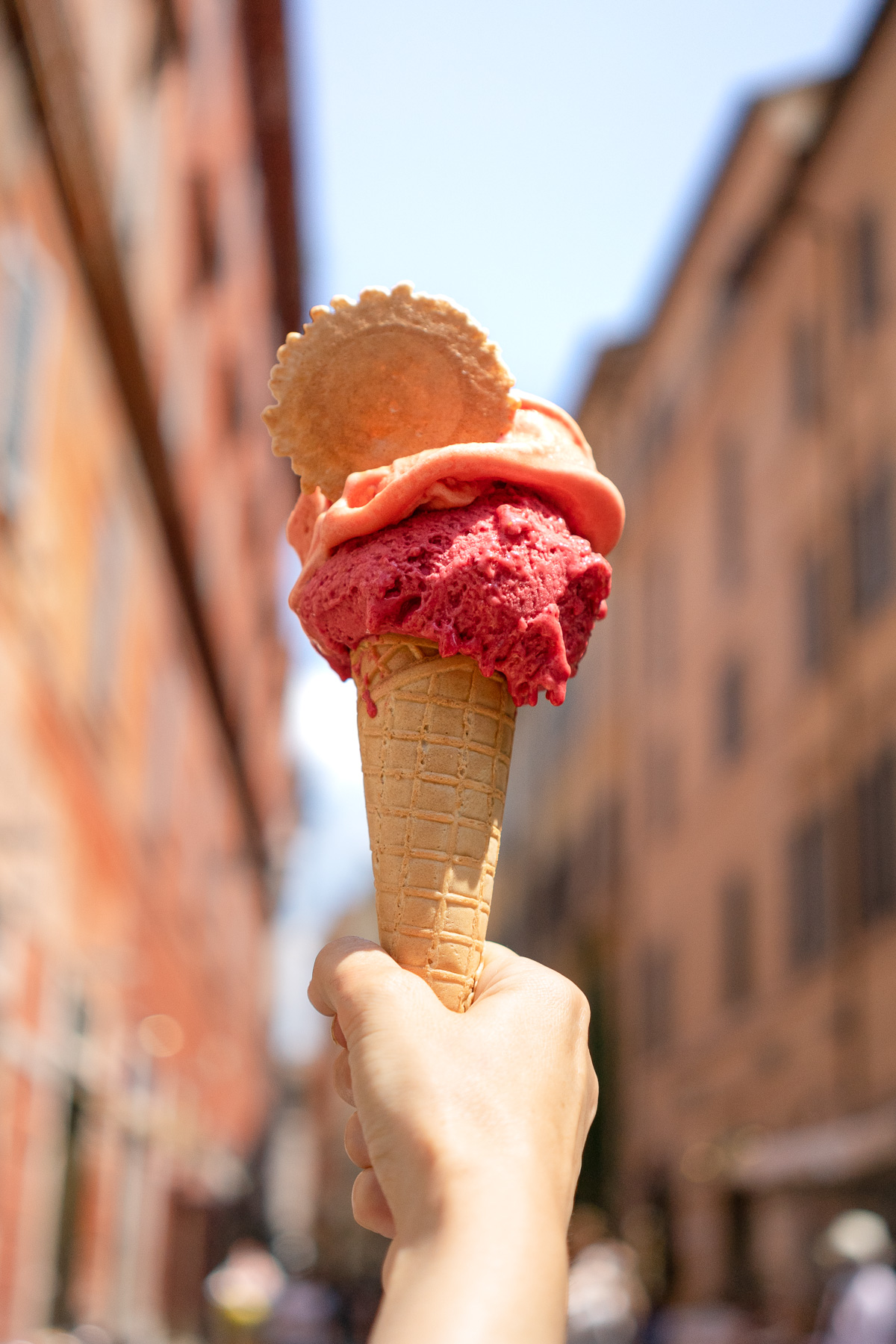 Hand holding a gelato in Rome