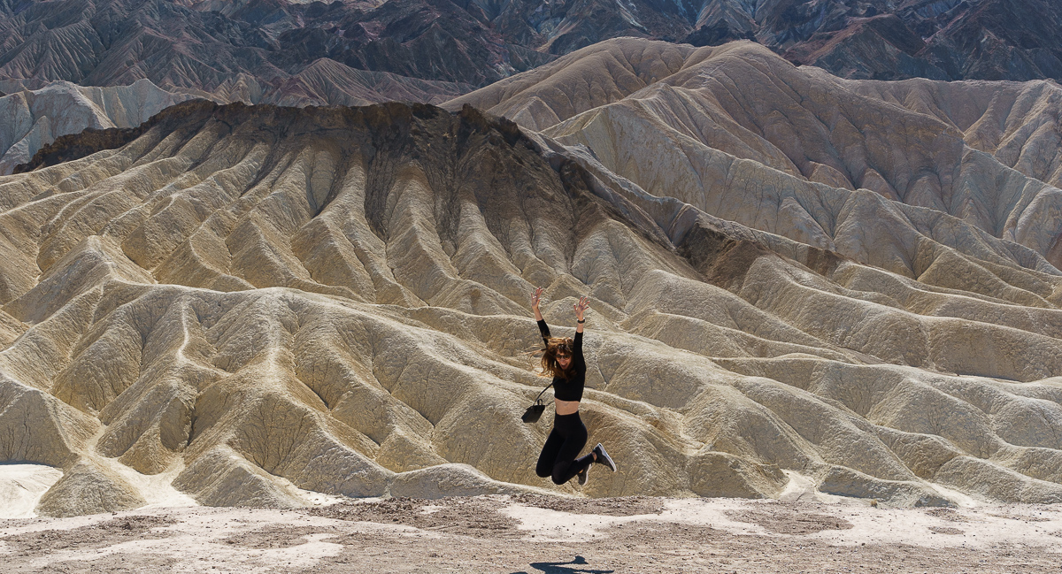 Woman jumping in the desert (Death Valley)