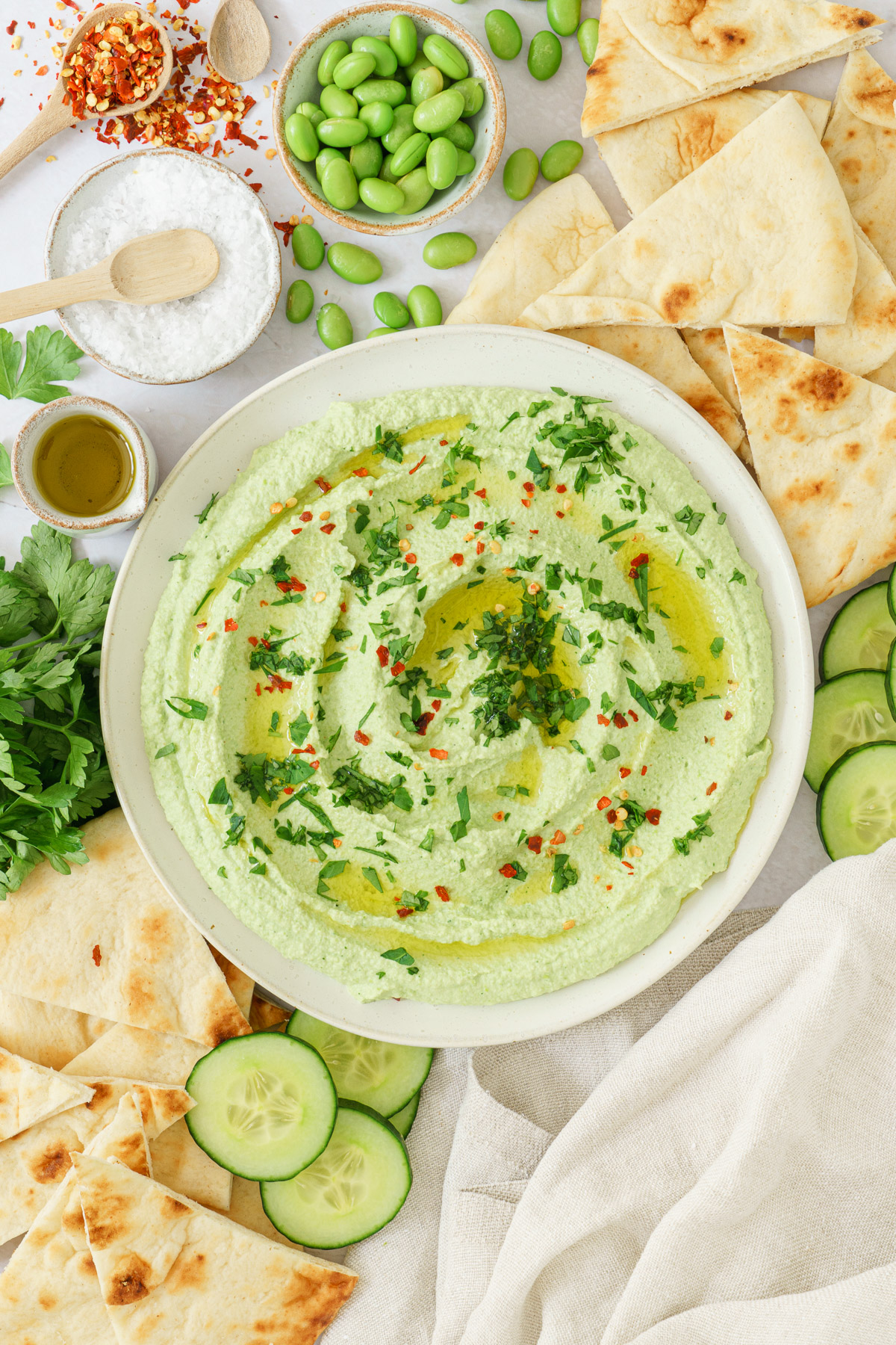 top view image of an edamame hummus in a bowl
