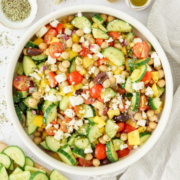 cropped image of greek chickpea salad in a bowl