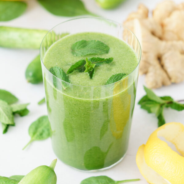 Glass filled with detox green smoothie.