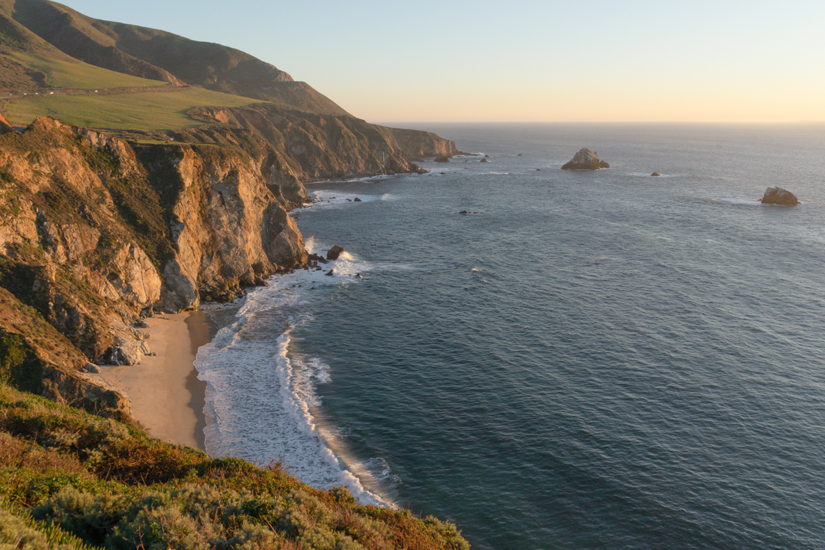 A romantic beach in Big Sur in California at sunset