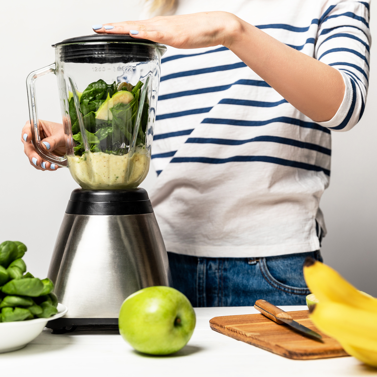 image of a person using a blender