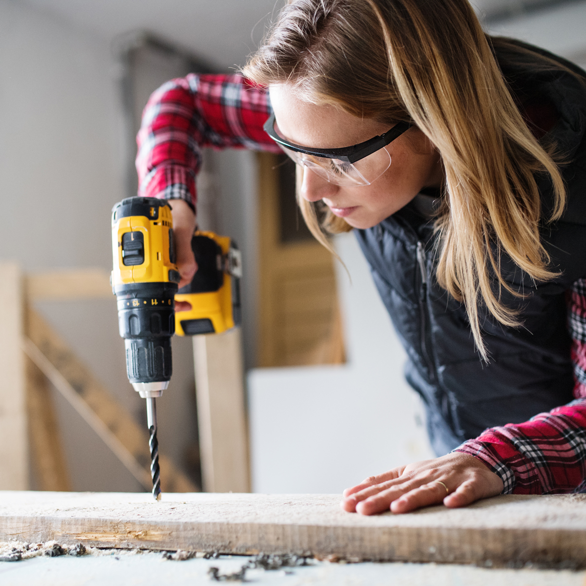 image of a woman working with power tools