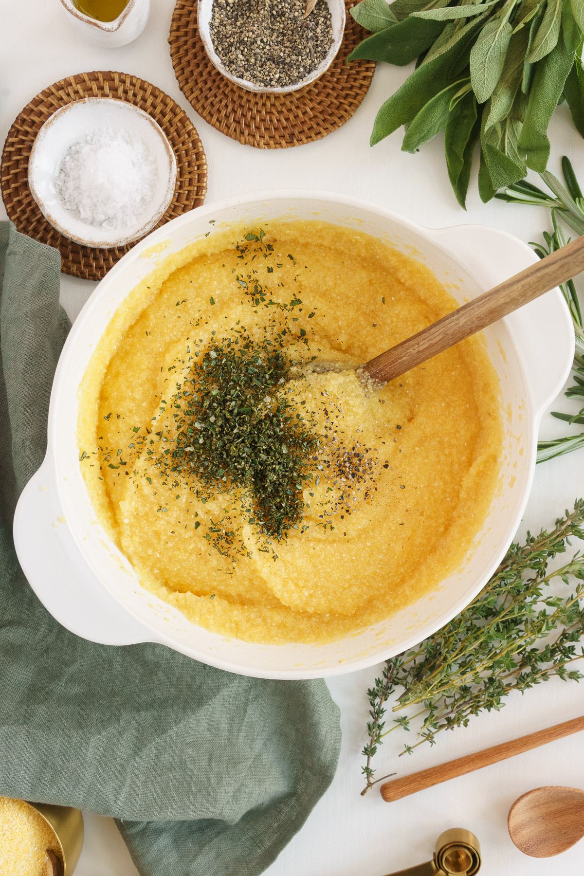 Adding herbs to polenta