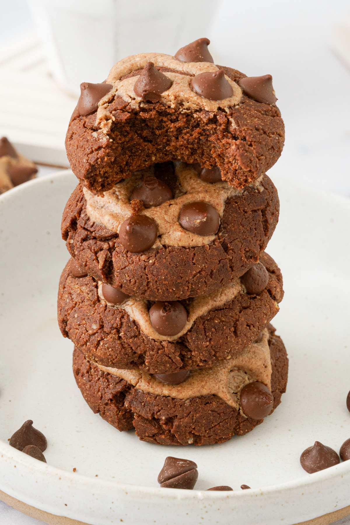 Plate with four stacked Chocolate Chickpea Flour Cookies