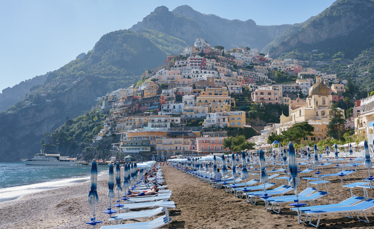 a beautiful view of the beach marina grande with Positano in the background