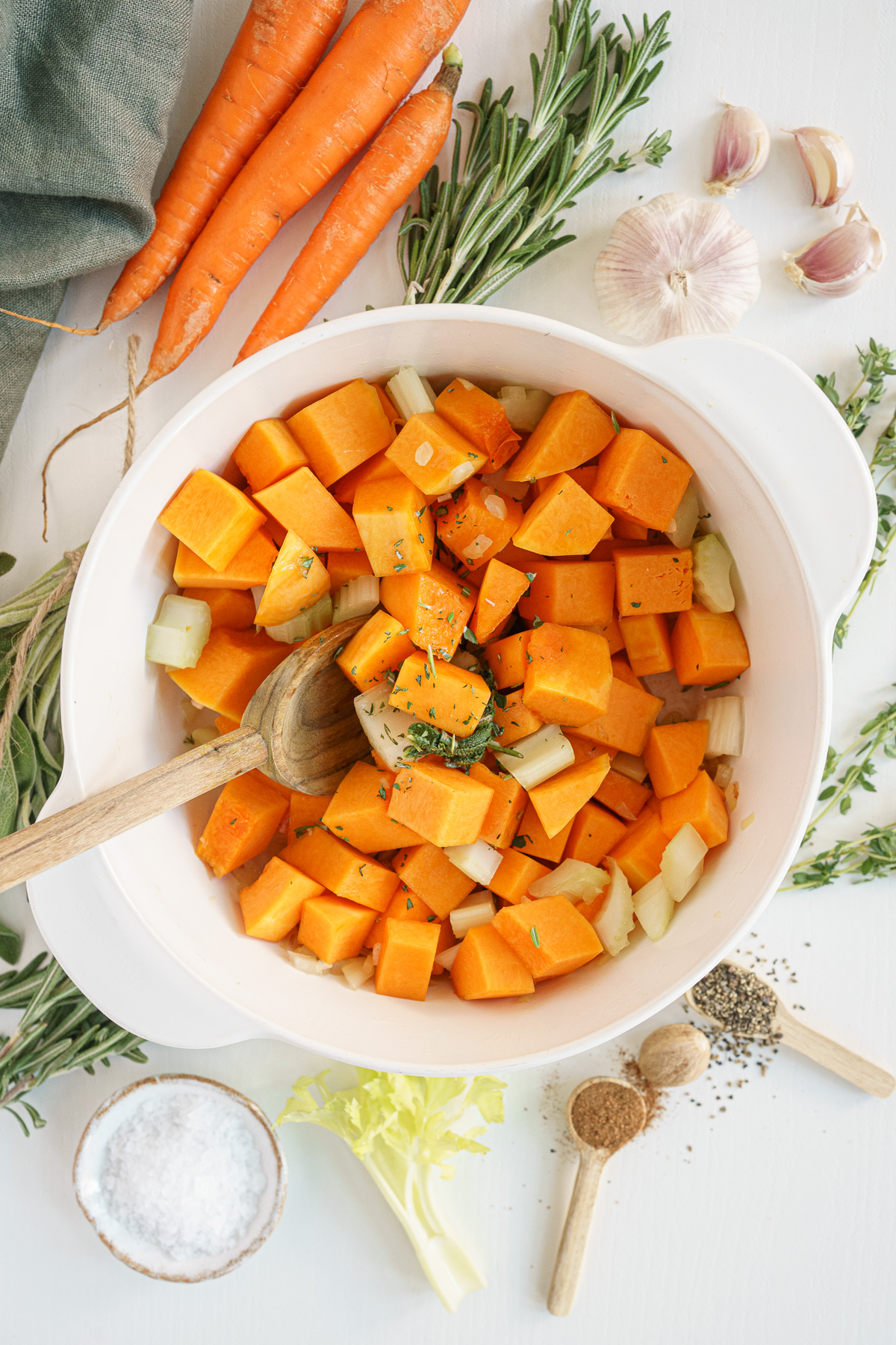 Pot filled with butternut squash, onion, garlic, and sage