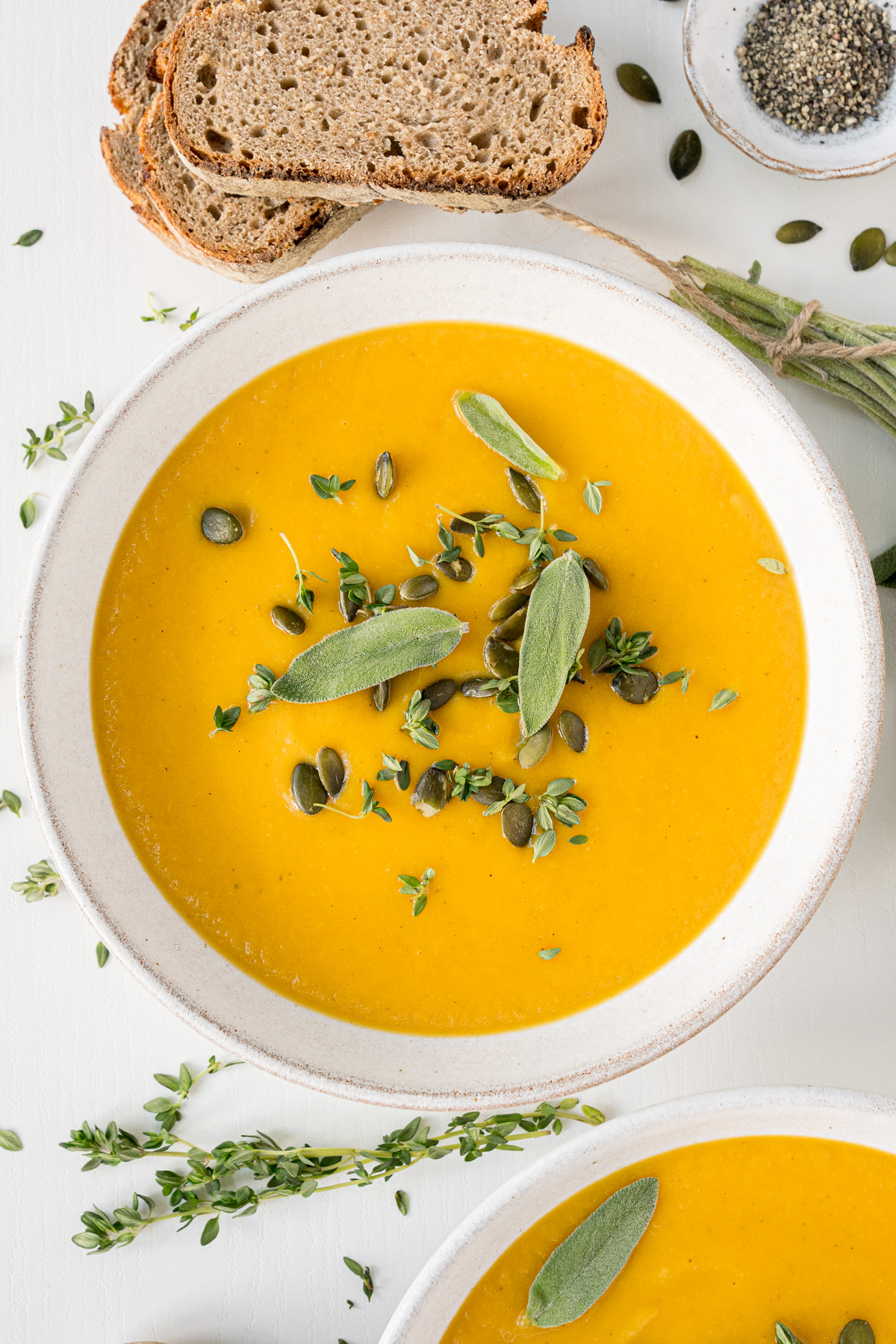Top view of bowls filled with butternut squash soup