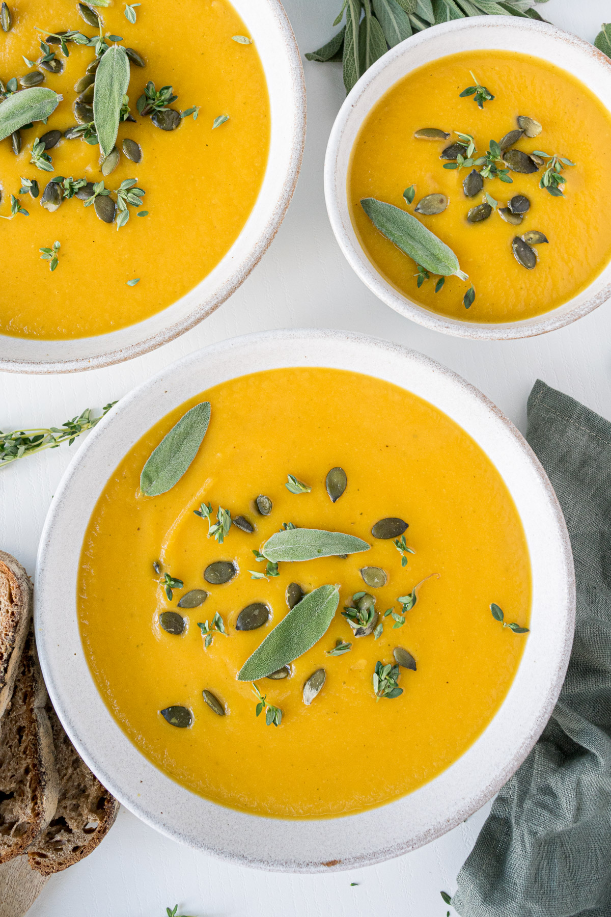 Top view of plates filled with vegan butternut squash soup
