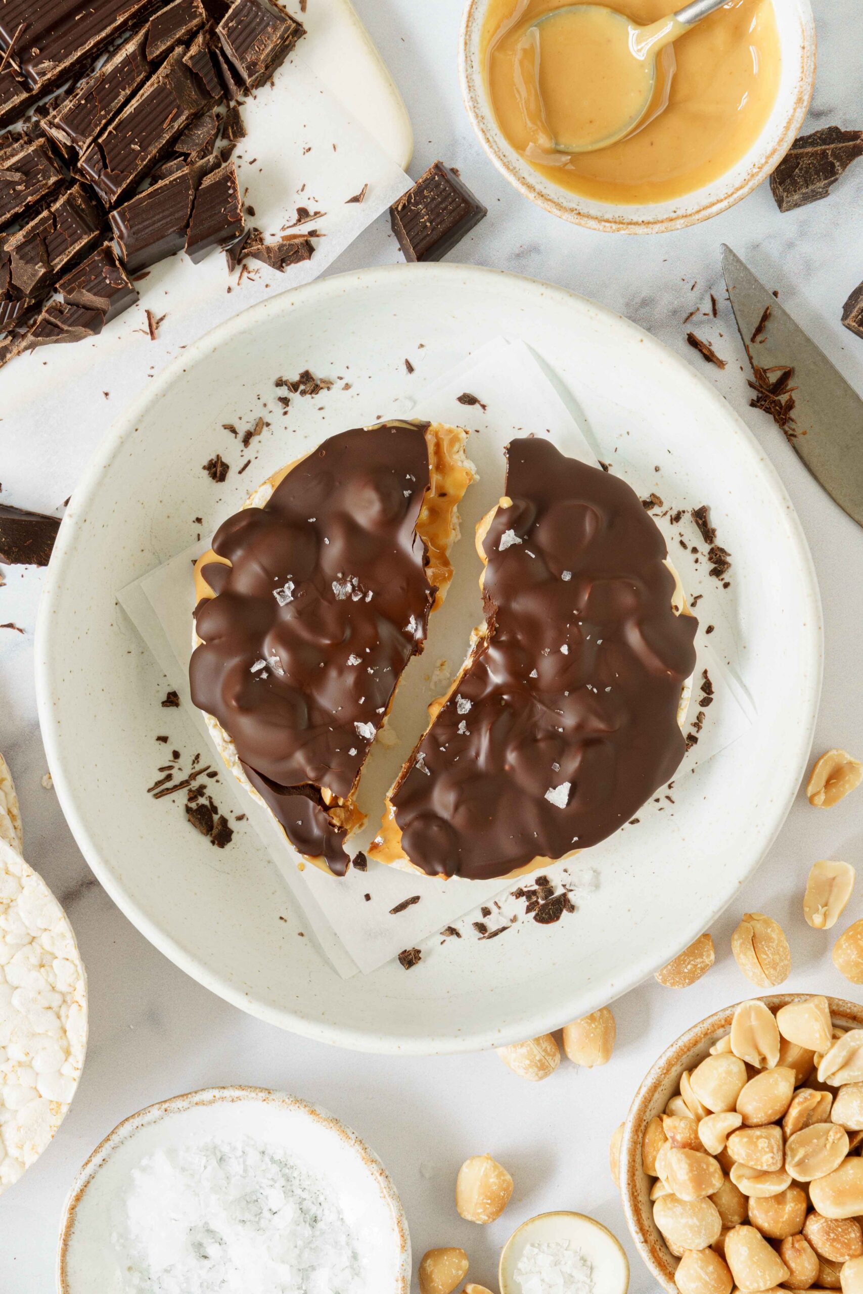 Peanut butter rice cake split in half in a serving plate.
