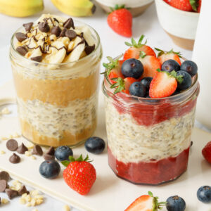 Two jars of overnight oats with various toppings.