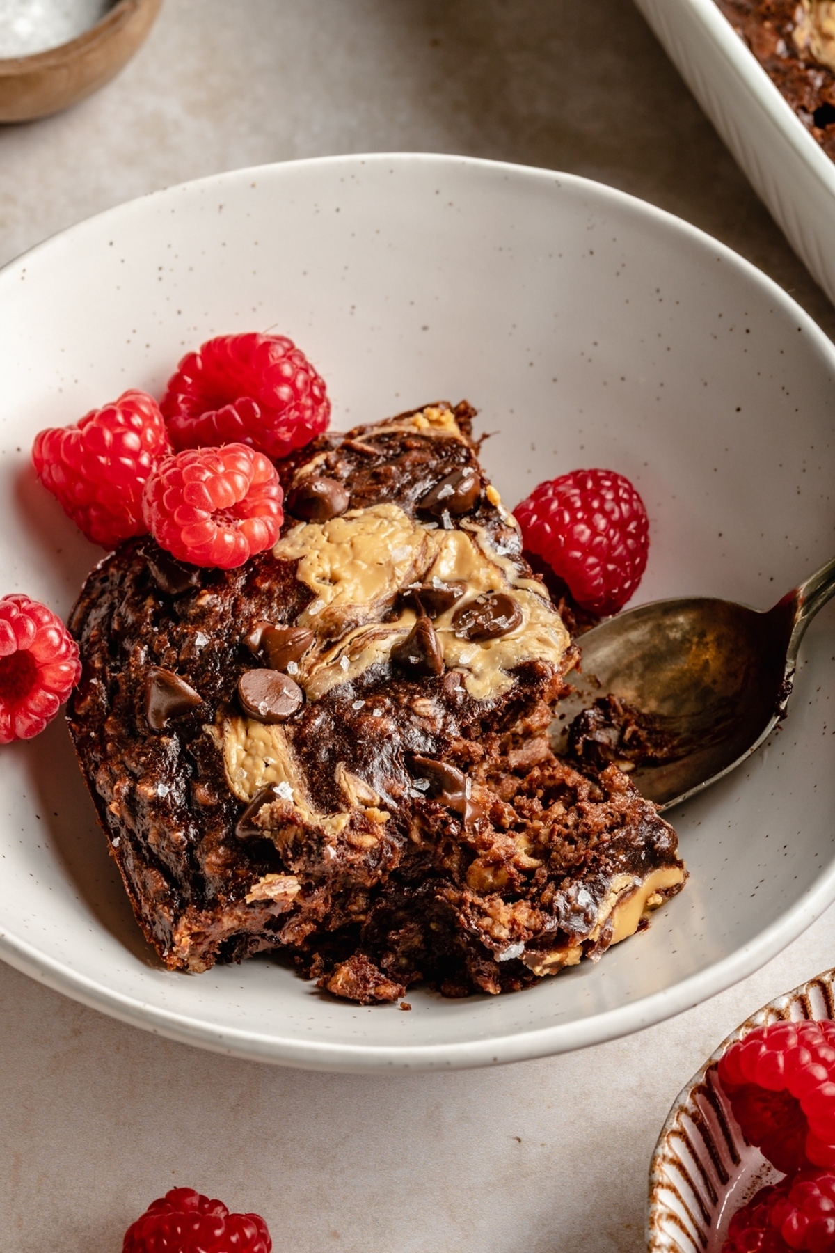 Chocolate peanut butter banana baked oatmeal on a bowl.