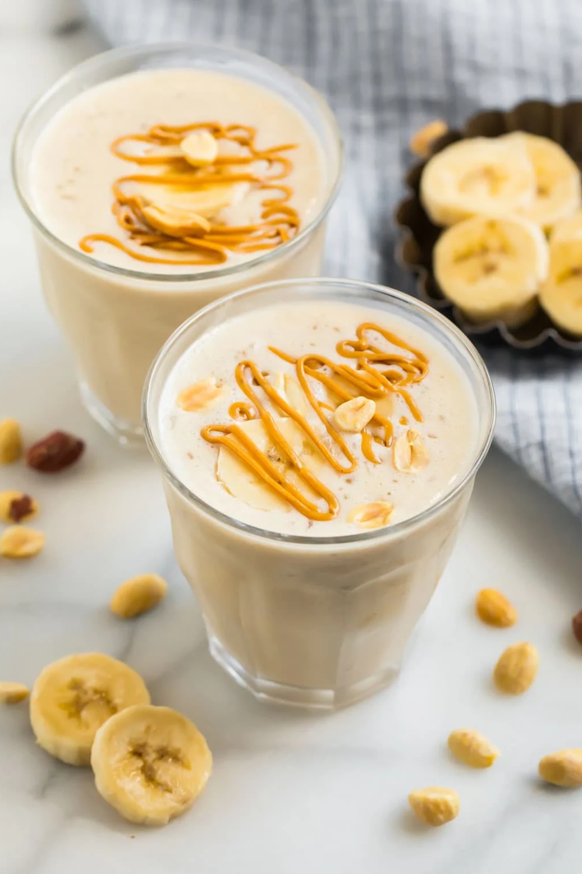 Peanut butter banana smoothie on a glass.