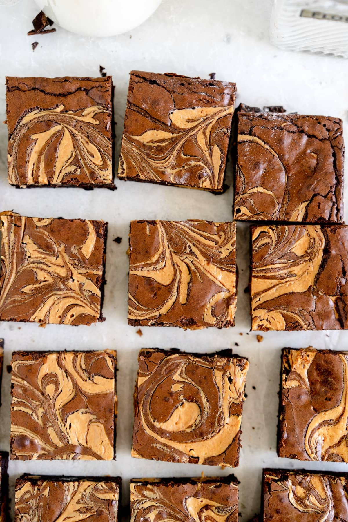 Peanut butter brownies laid on a baking tray.