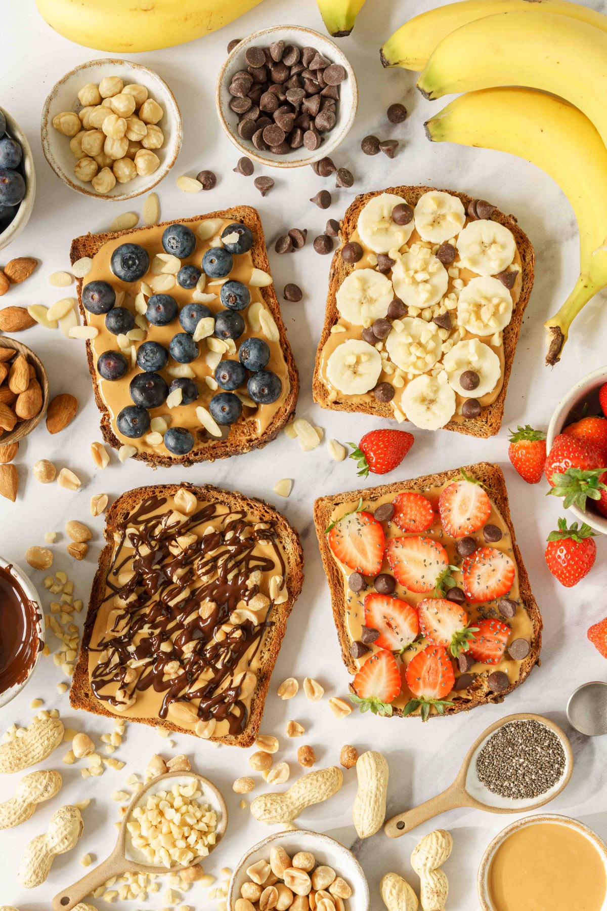 Peanut butter toasts with various toppings.