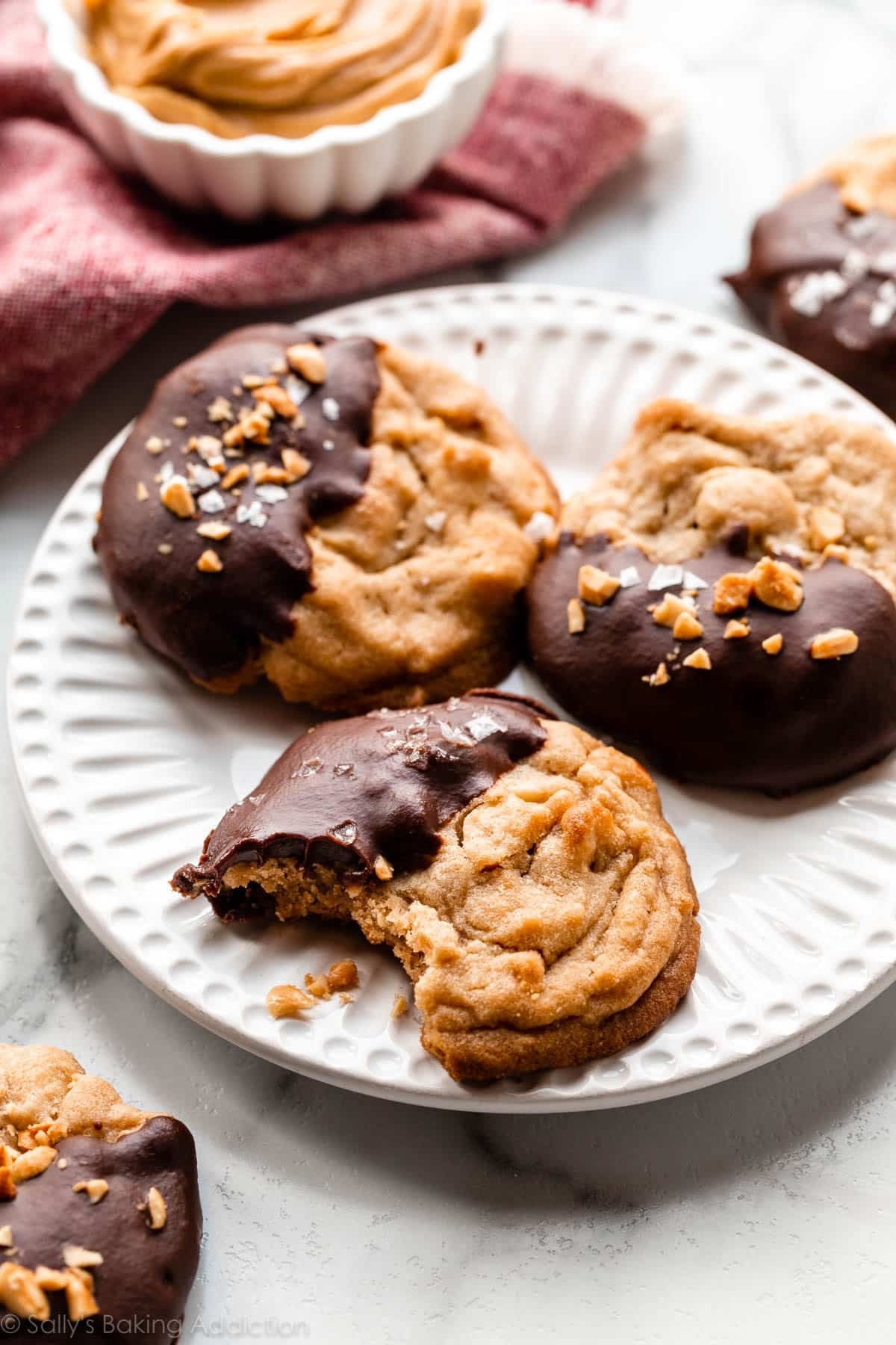 Peanut butter chocolate half moon cookies on  a plate.