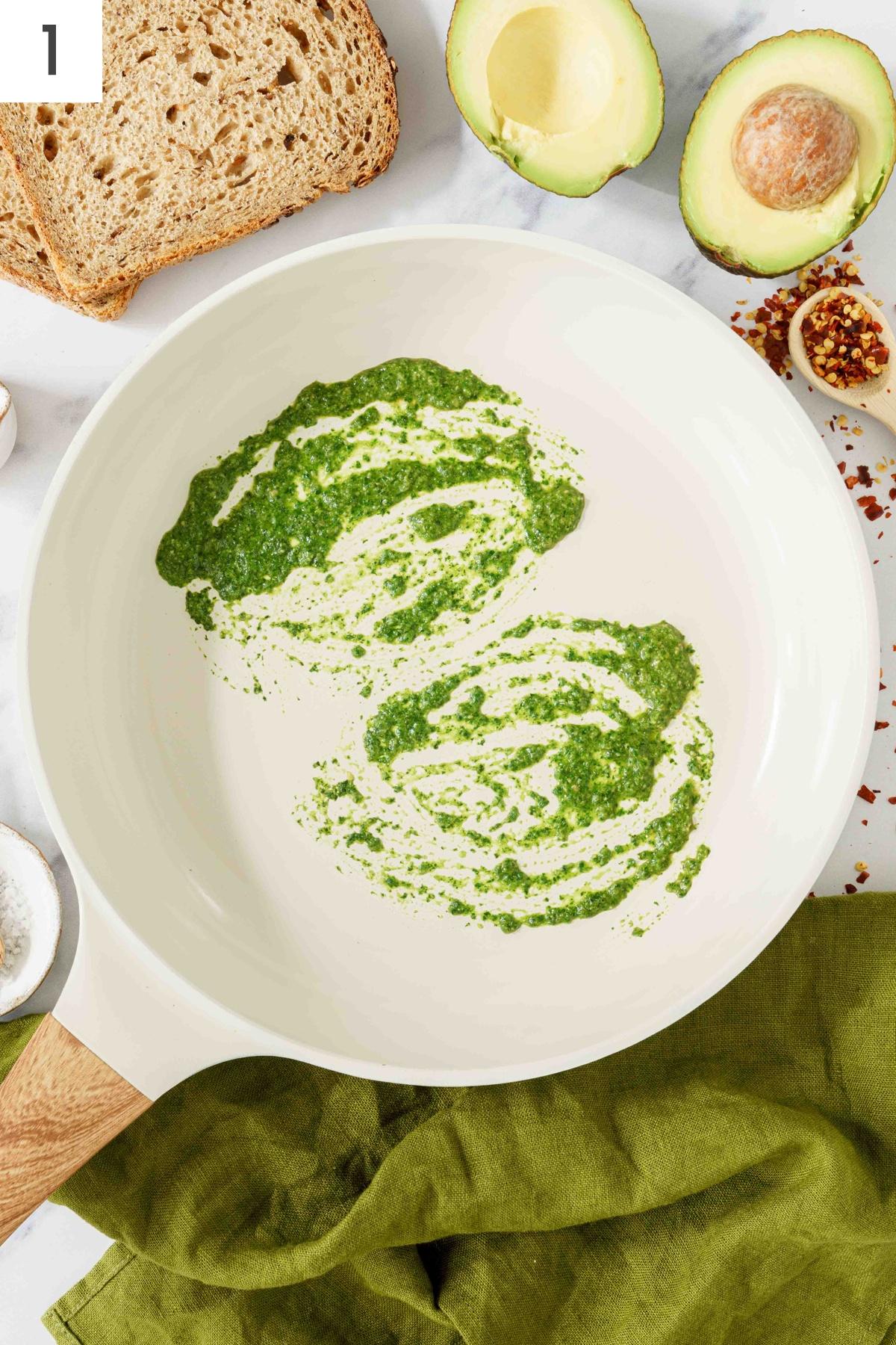 A pan spread with pesto.
