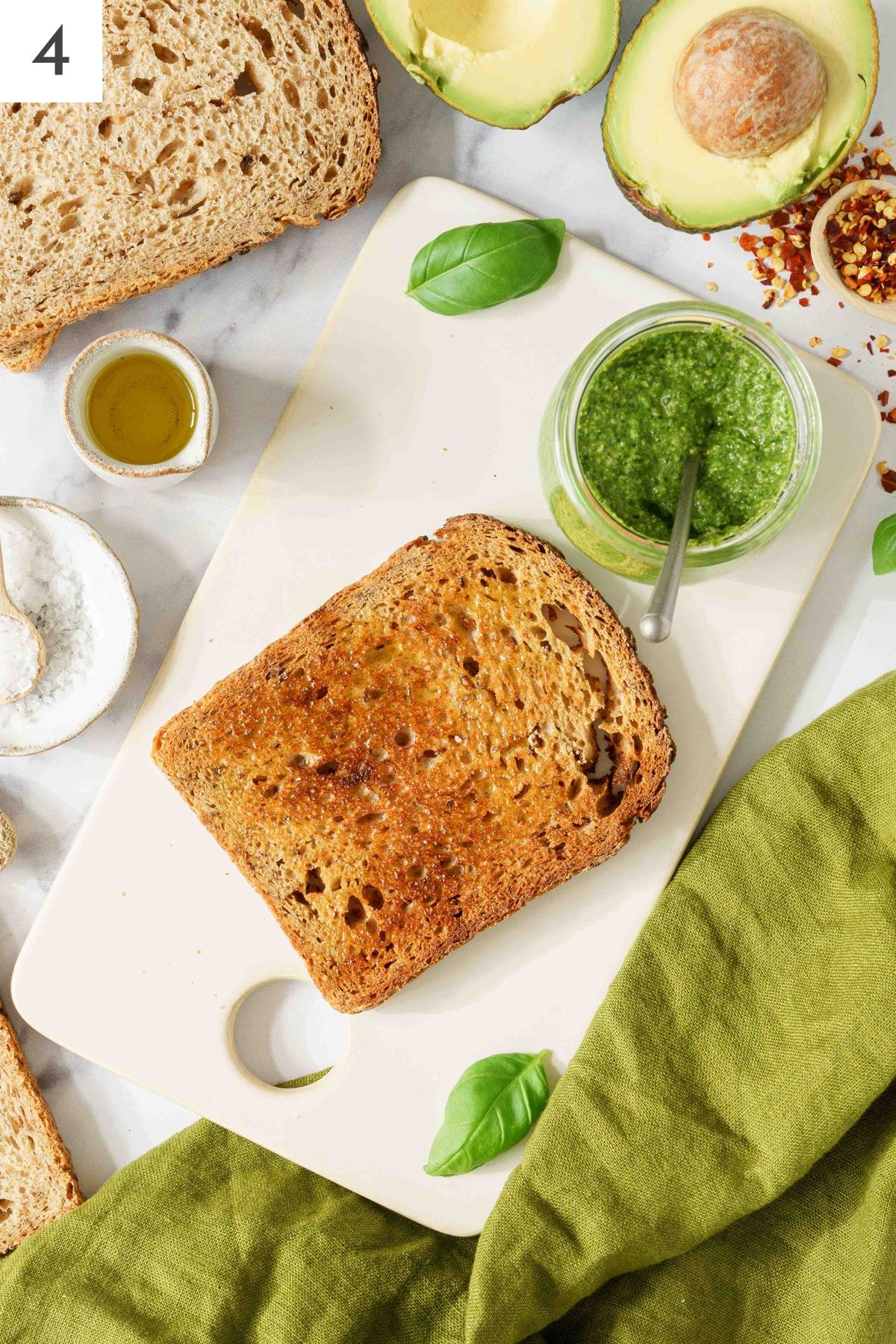 A slice of bread on a cutting board.