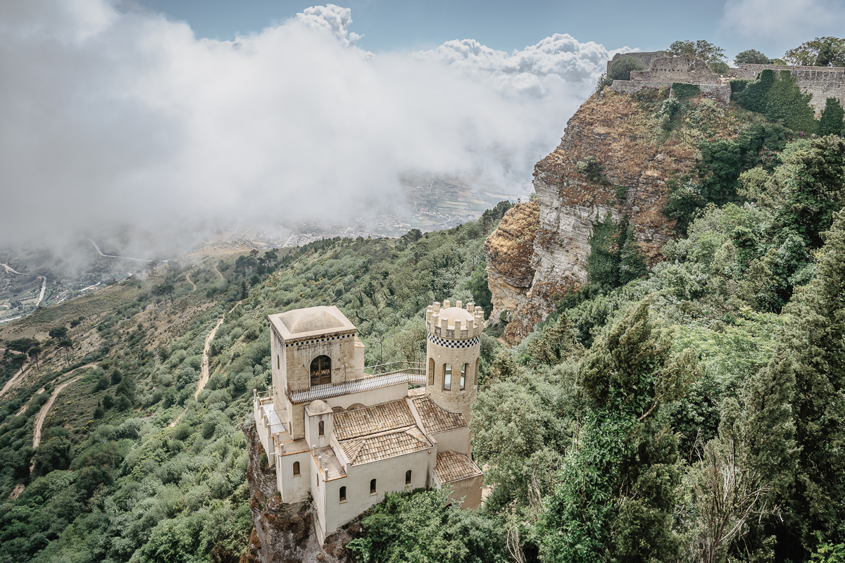 Misty panorama in Erice, with a view of Venus Castle, Castello di Venere, in clouds.