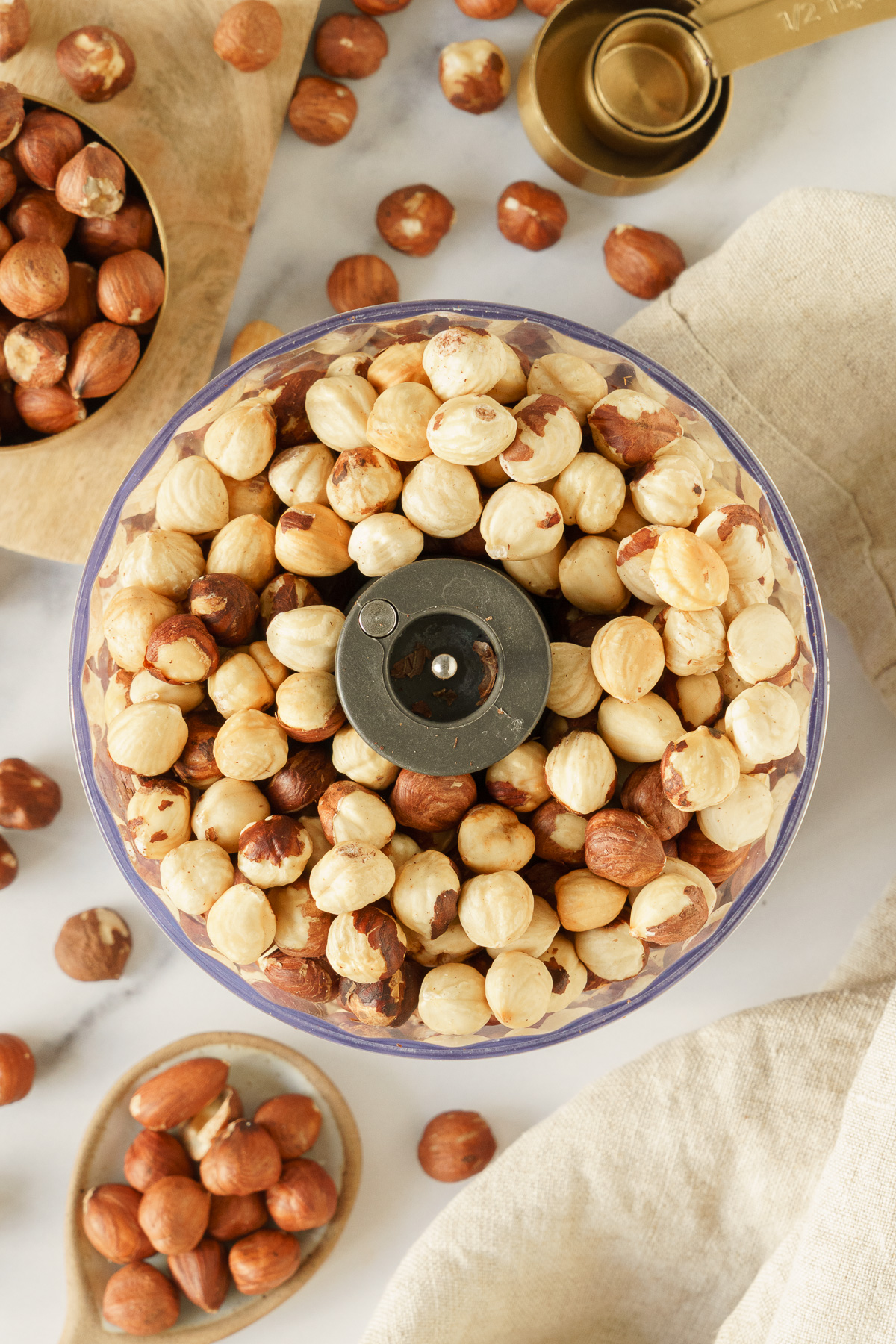 Peeled hazelnuts in a food processor.